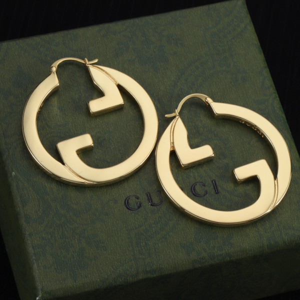 G*u*i earrings
