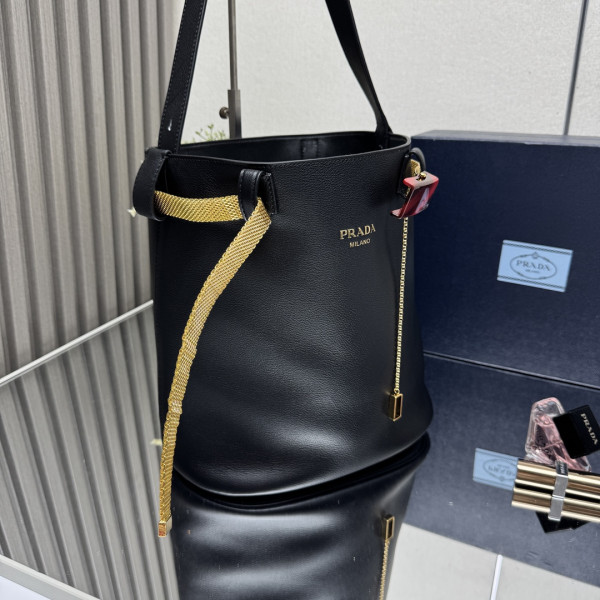 Pra*a buckle leather bucket bag with jeweled belt